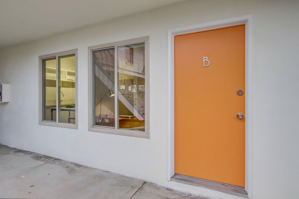Signature mid-century orange front door marked B